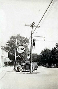 Jesse Newitt working on a phone cable at Quincy Square